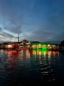 sulphur creek marina lit up at night. lights reflecting in the water