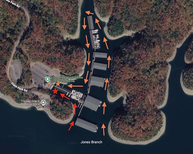Bird's eye view of marina with arrows directing to parking spots.